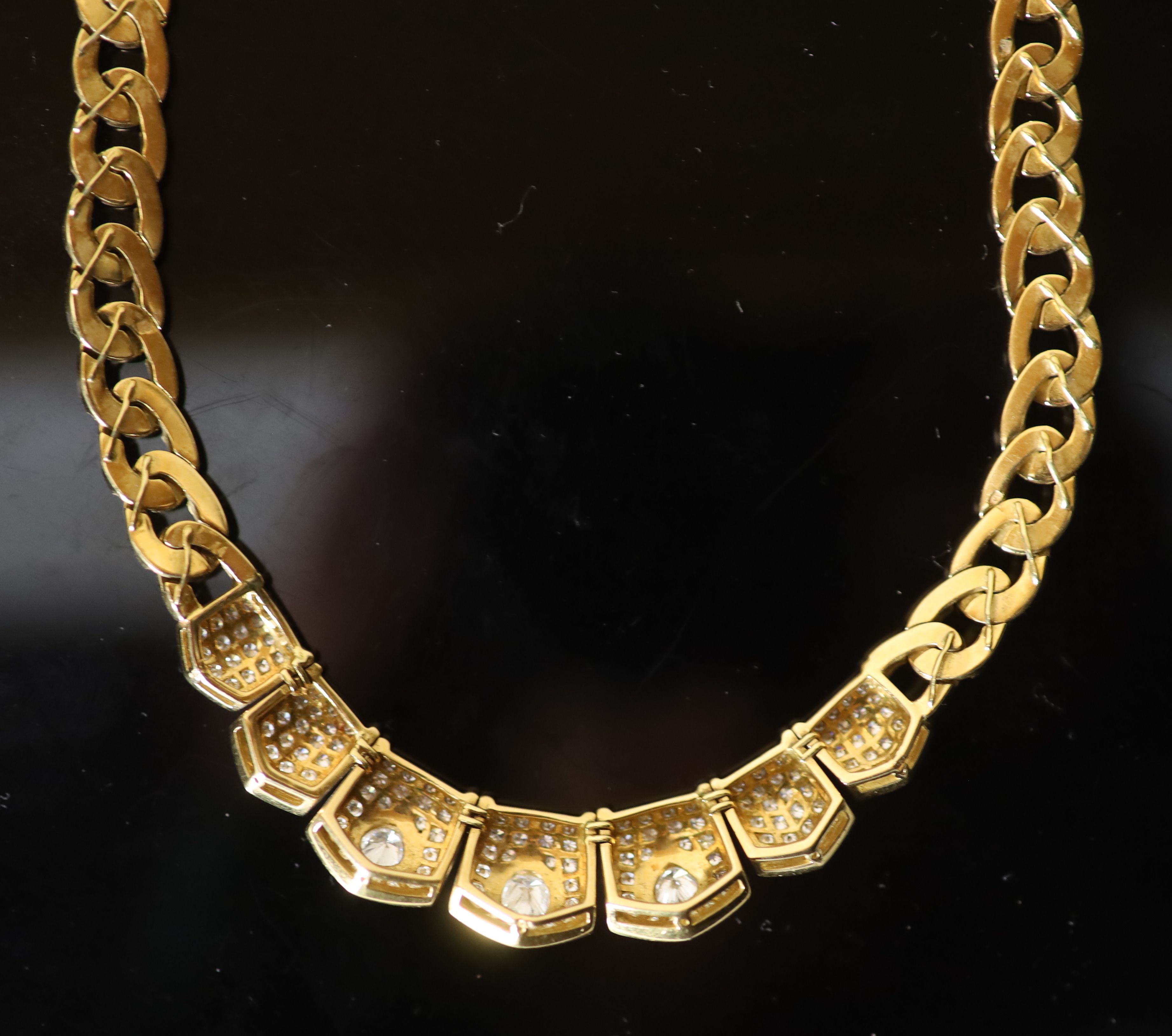 A modern Middle Eastern (possibly Egyptian) gold and diamond set oval curblink necklace,